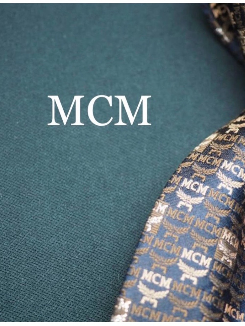 MCM Blue Tie with Gold Monogram Pattern